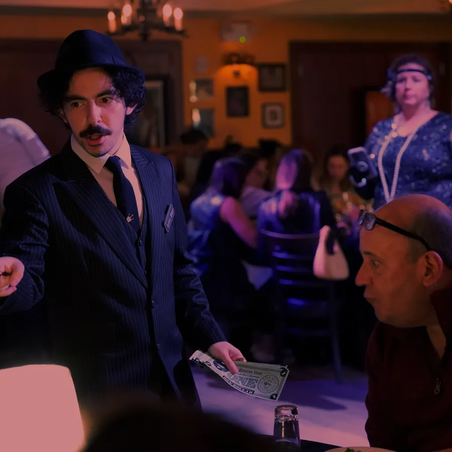 A Murder Mystery Company actor working the room at a Seattle show