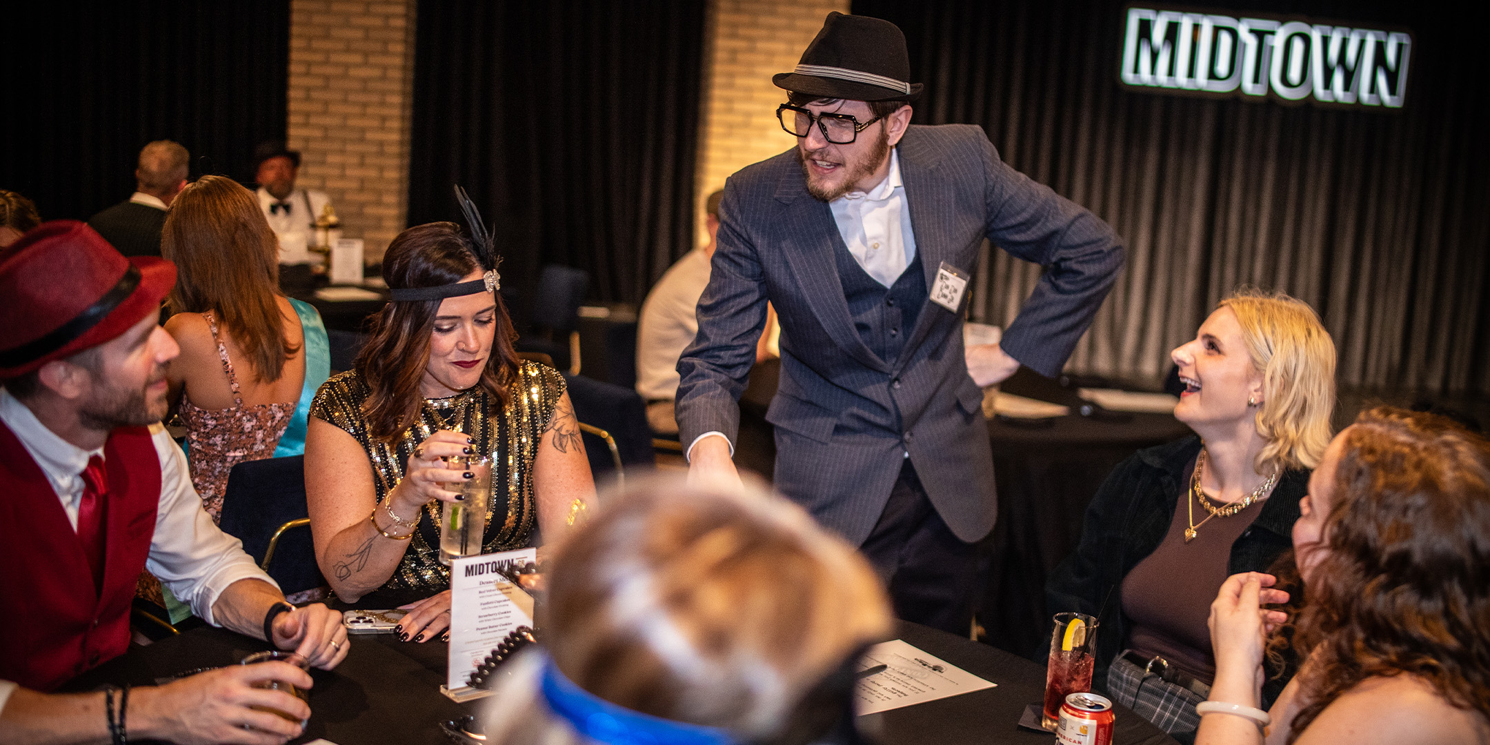 Guests at a Murder Mystery Company public dinner show in Seattle